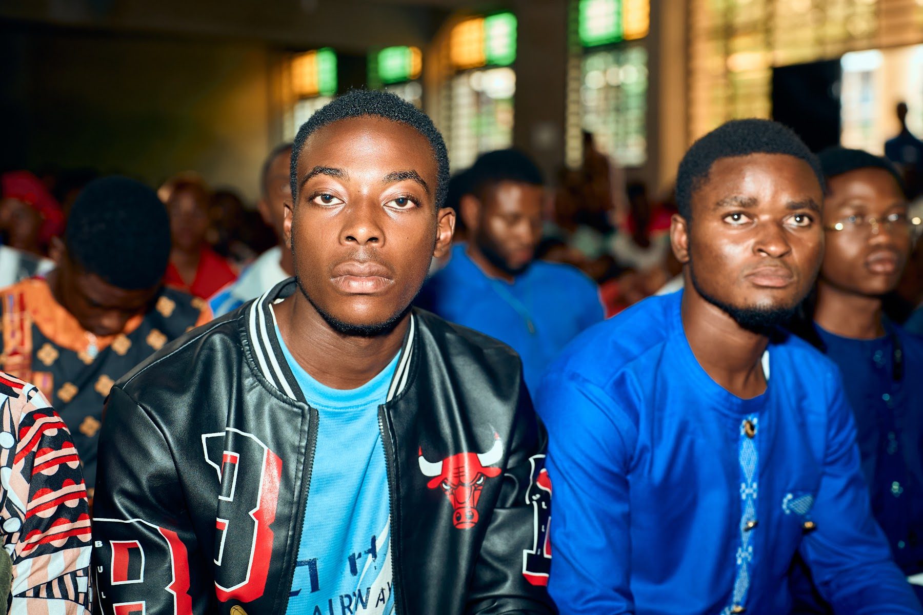 Young people seated together during the service